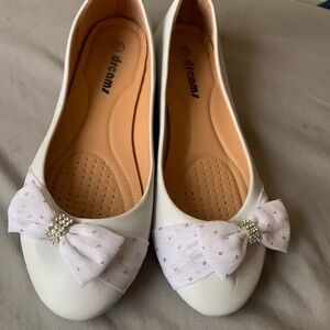 White shoes with a bow in the front